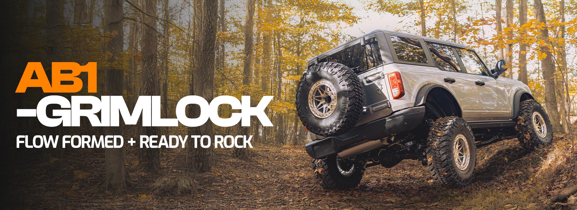 ab1 grimlock flow formed off road wheel on silver ford bronco in forest graphic banner