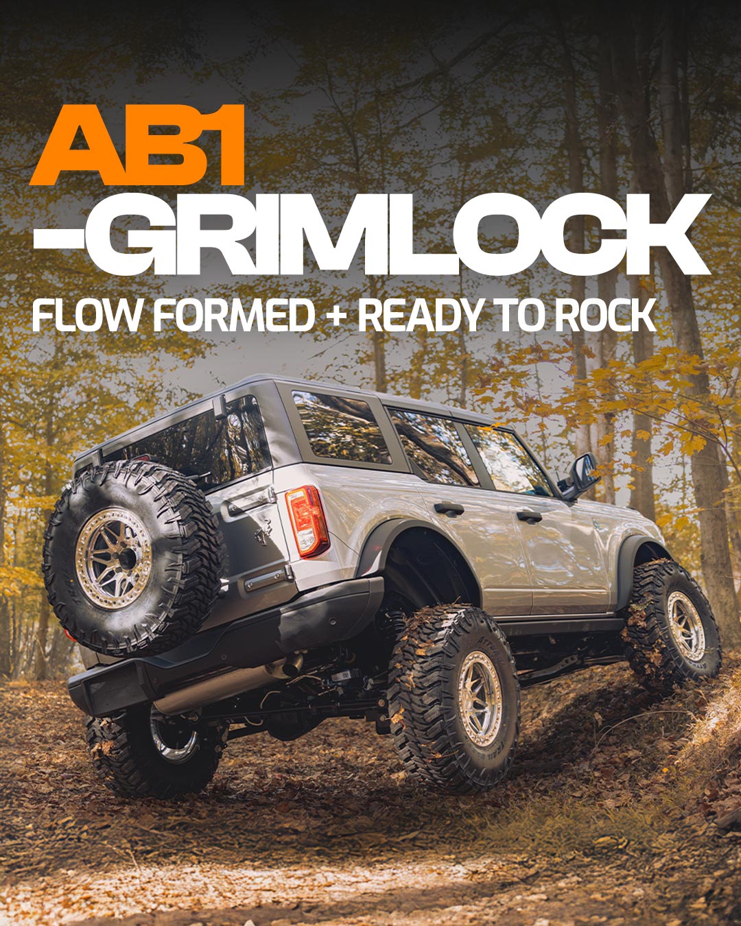 ab1 grimlock flow formed off road wheel on silver ford bronco in forest graphic banner