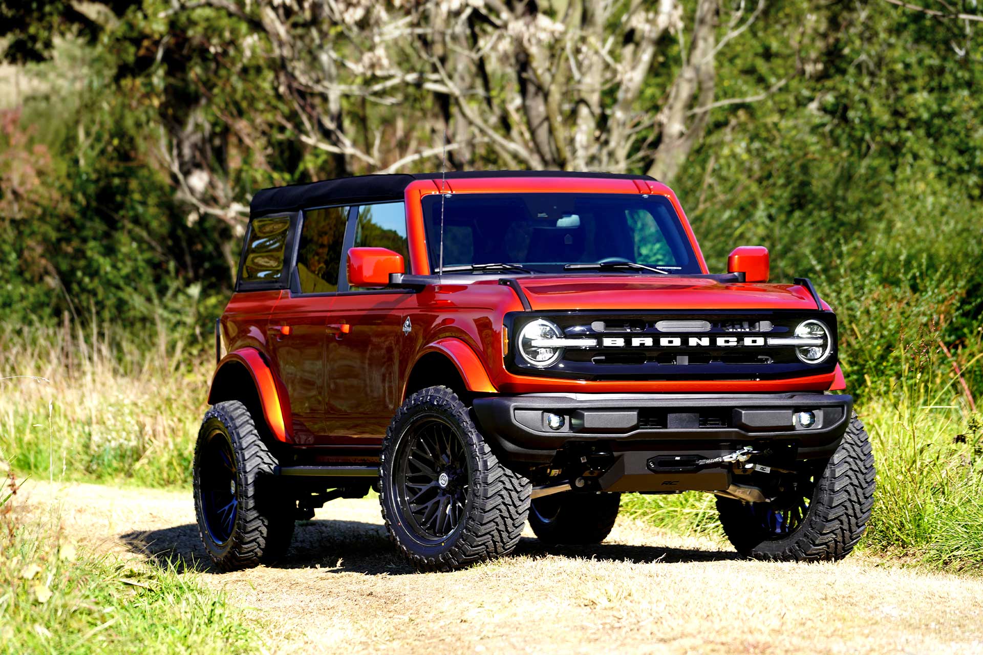 orange ford bronco with with gloss black artem off road a206 novus wheels