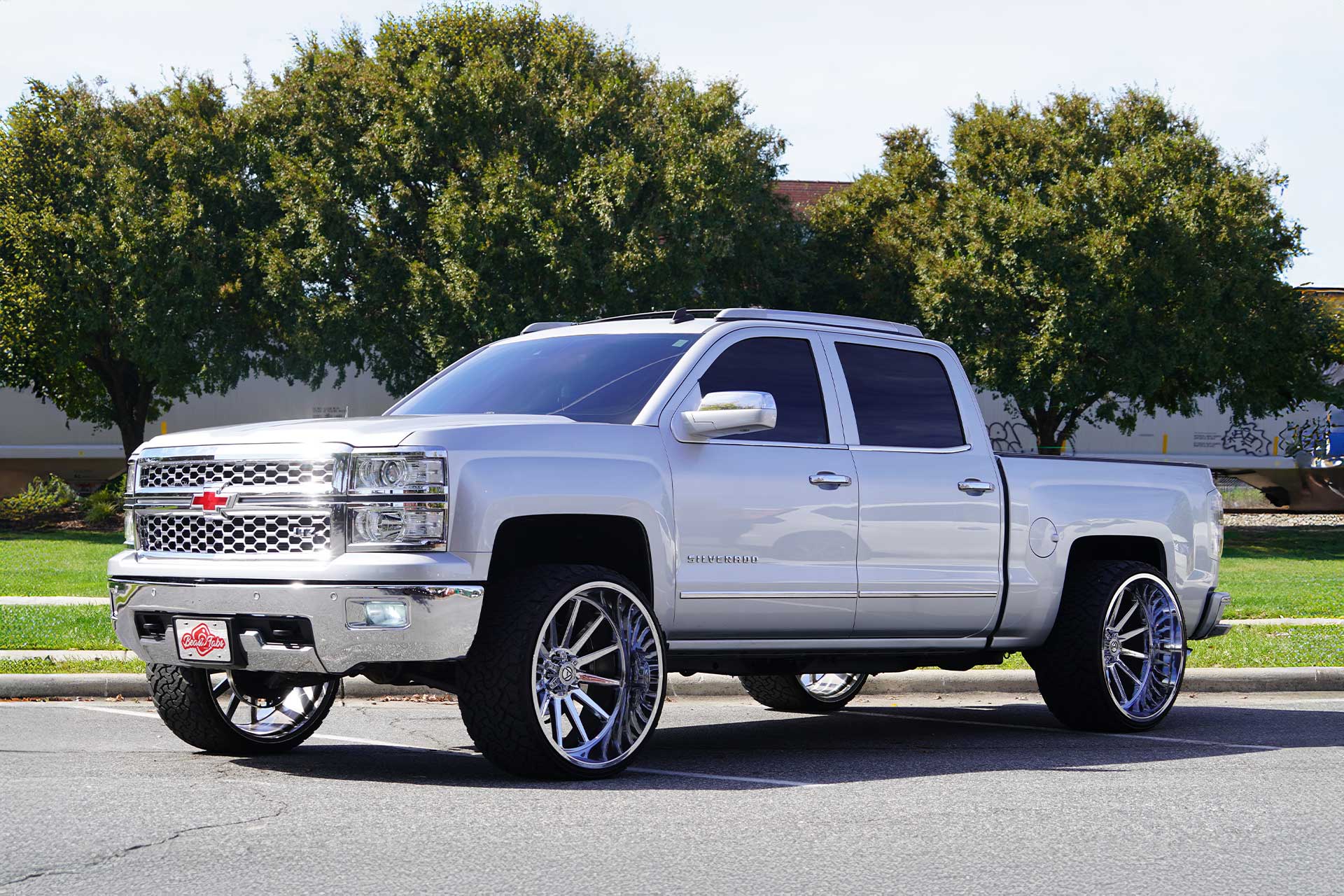 silver chevy silverado 1500 with chrome artem offroad a203 seneca wheels
