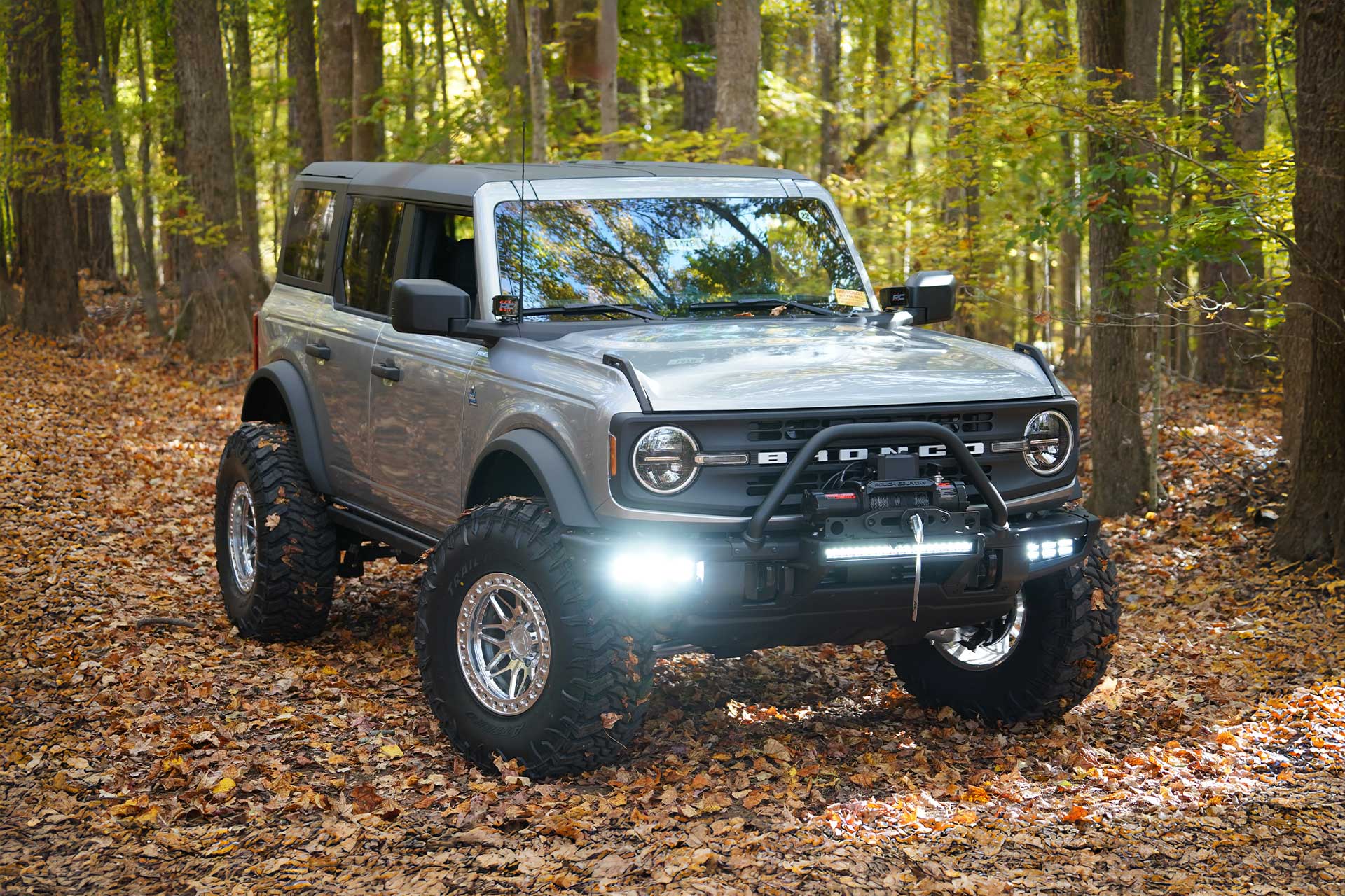 silver ford bronco with chrome artem off road ab1 grimlock wheels